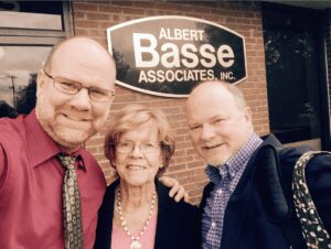 Photo of Albert "Chip" Basse, Edwin "Ed" Basse, and mother Ellen Basse in the 90's after Chip takes over as CEO of Albert Basse Associates in Stoughton, MA